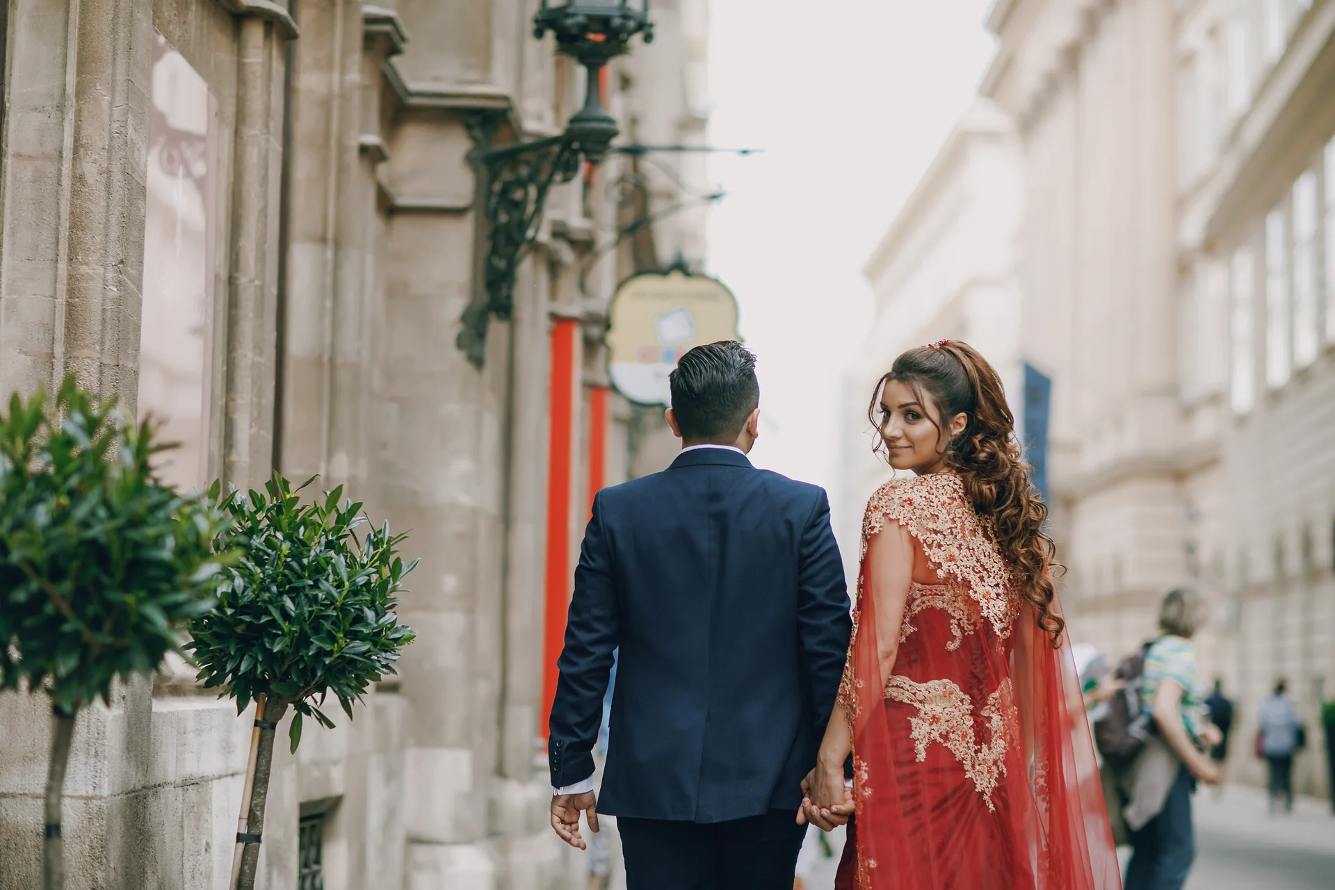 Couple walking together through a bright city street